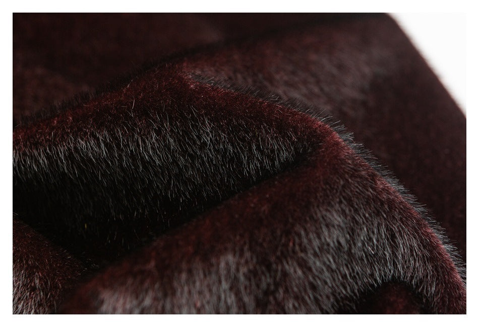 Extreme close-up of dark burgundy and black plush fur with short, glossy fibers.