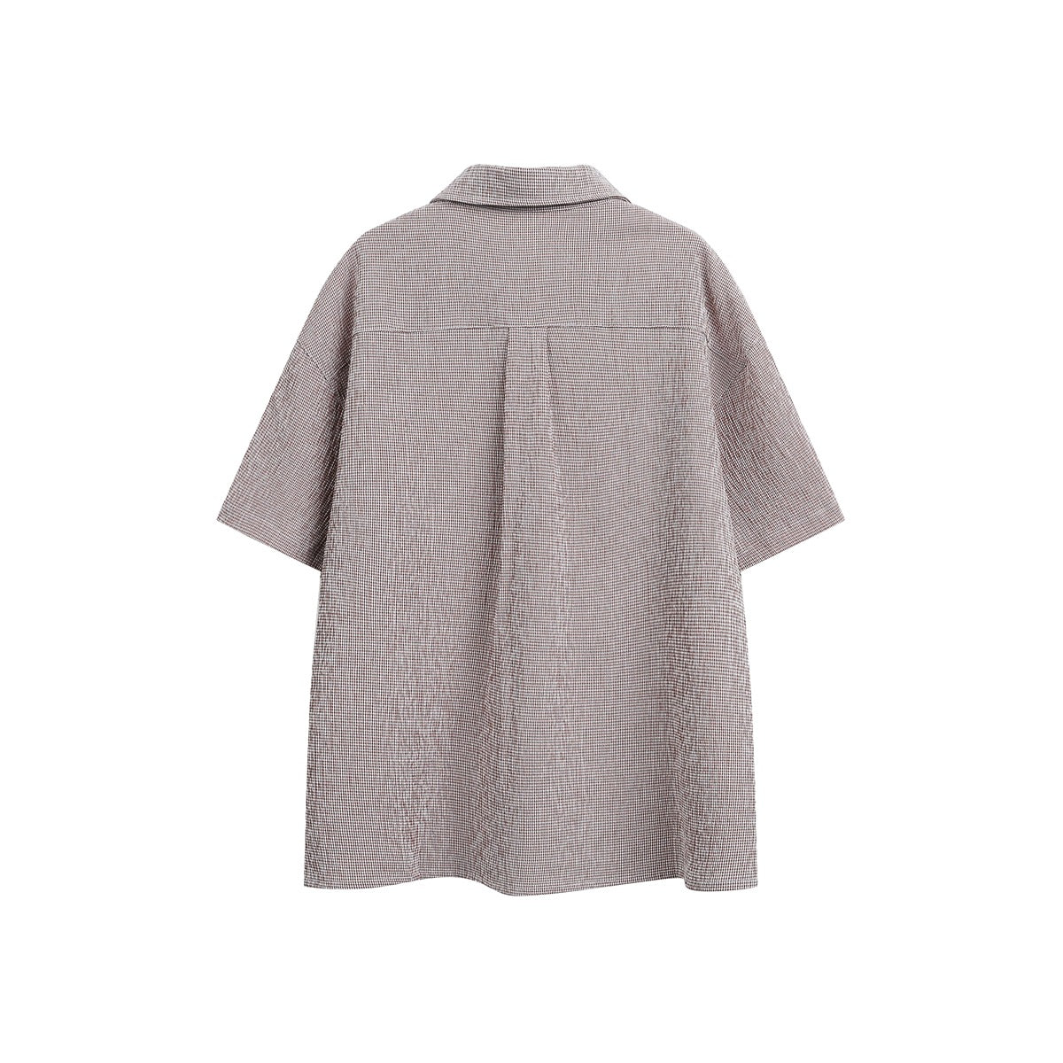 Back view of a brown-and-white check short-sleeve button-up shirt with a center back pleat.