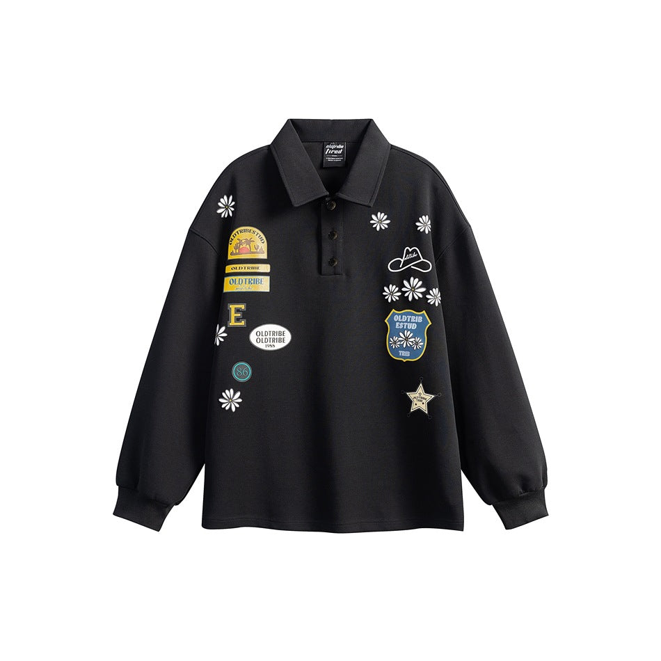 Black long-sleeve polo sweatshirt with daisy and patch-style graphic prints, front view on white background