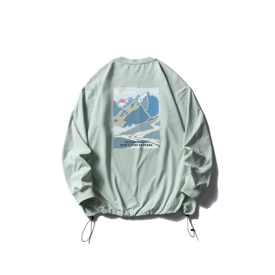 Pale sage sweatshirt back with a mountain graphic, English slogan, ribbed cuffs, and adjustable hem drawstrings.