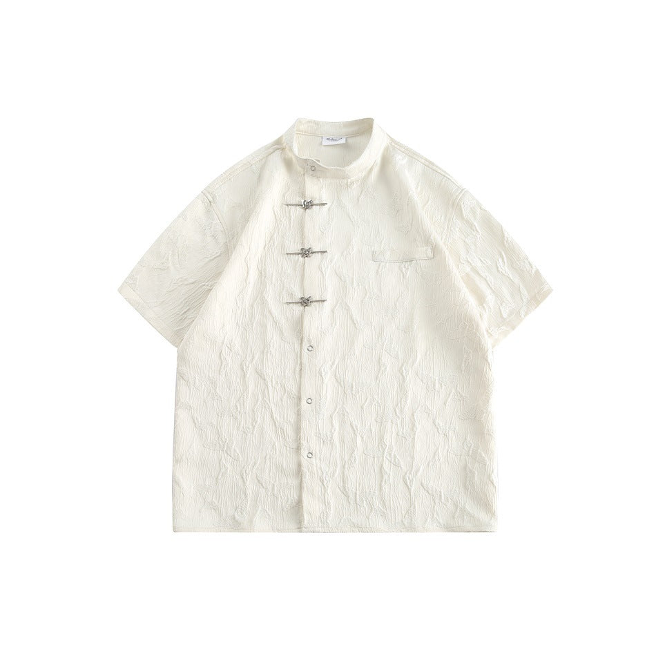 Off-white textured short-sleeve stand-collar shirt with three metal butterfly fasteners and chest pocket, flat lay