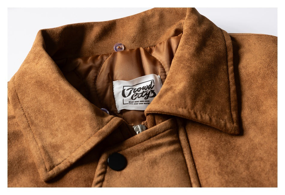 Close-up of the brown jacket's pointed collar, snap closure, lining, zipper, and sewn neck label.