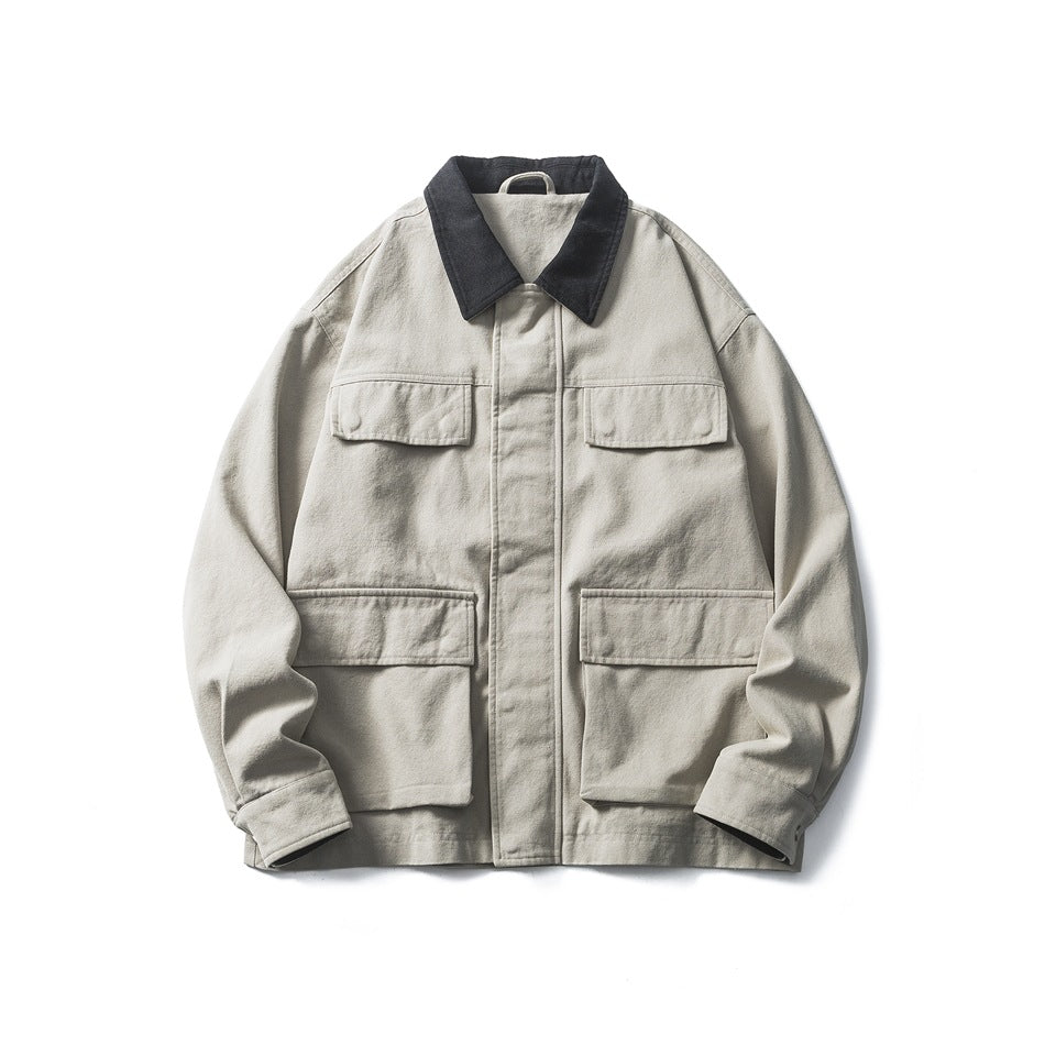 Smoke gray jacket flat lay with dark gray collar, four flap pockets and front placket