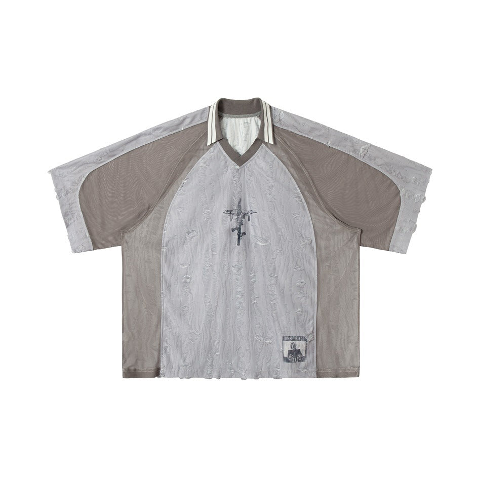 Gray and taupe short-sleeve polo-style jersey top with V-neck, striped collar and chest graphic, flat front view