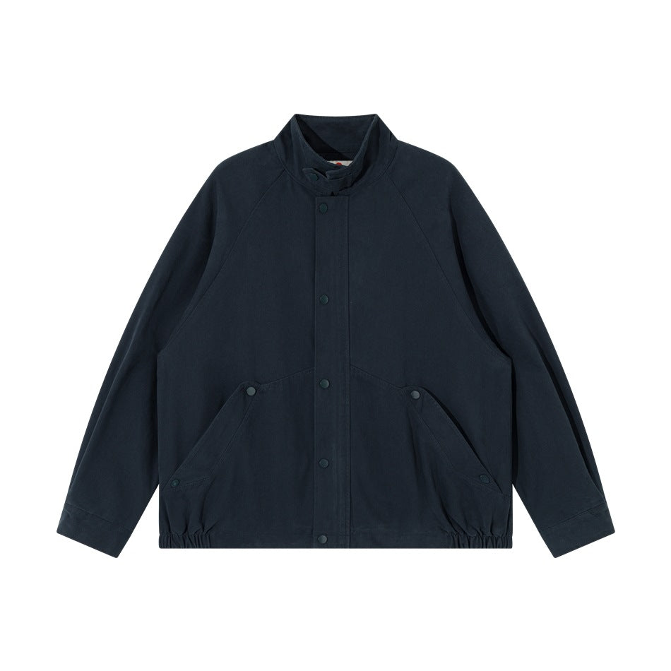 Navy stand-collar jacket flat lay, front view with snap placket, raglan sleeves and elastic hem