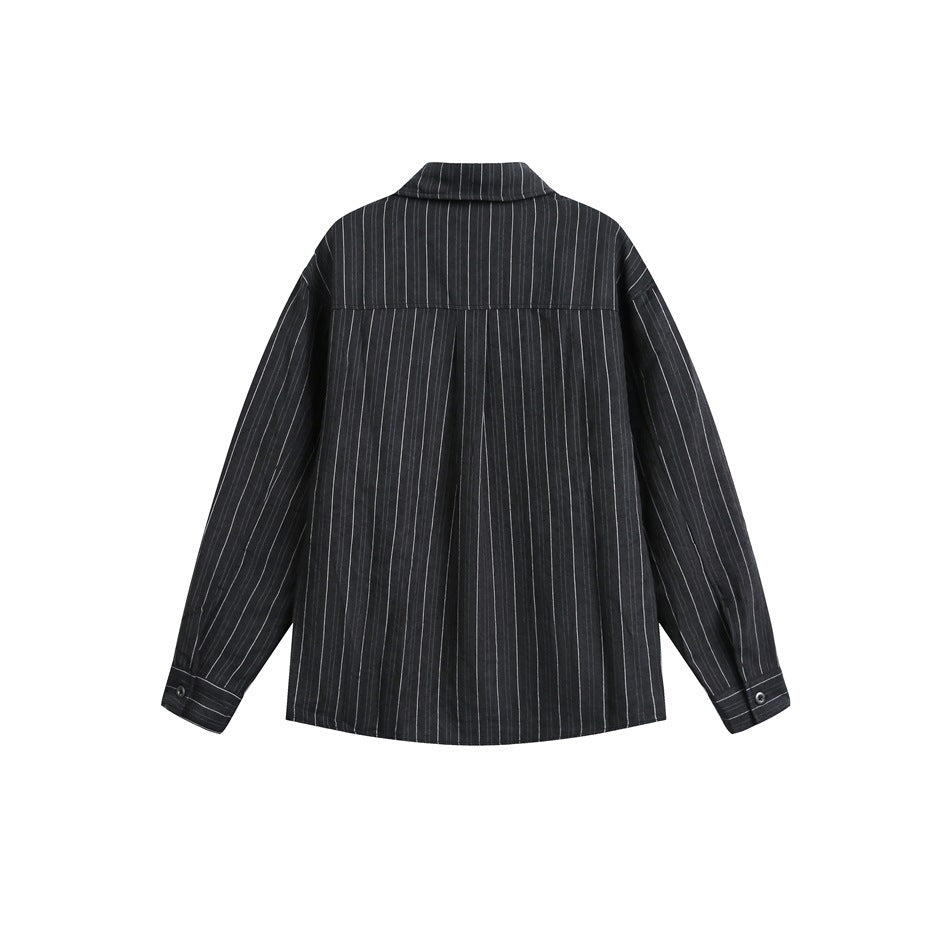 Back view of black pinstriped long-sleeve shirt showing back yoke seam, center pleat and buttoned cuffs