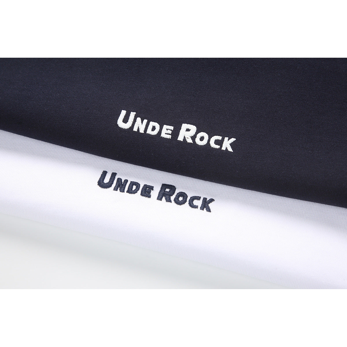 Close-up of navy and white fabric panels, each printed with the words “Under Rock.”