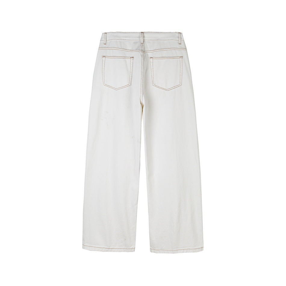 Back view of white wide-leg jeans with two patch pockets and tan contrast stitching.