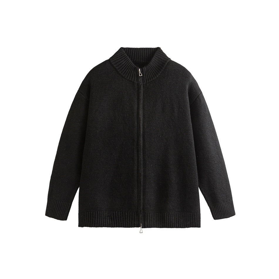Black knit zip-up cardigan with ribbed stand collar, cuffs and hem, flat lay on white
