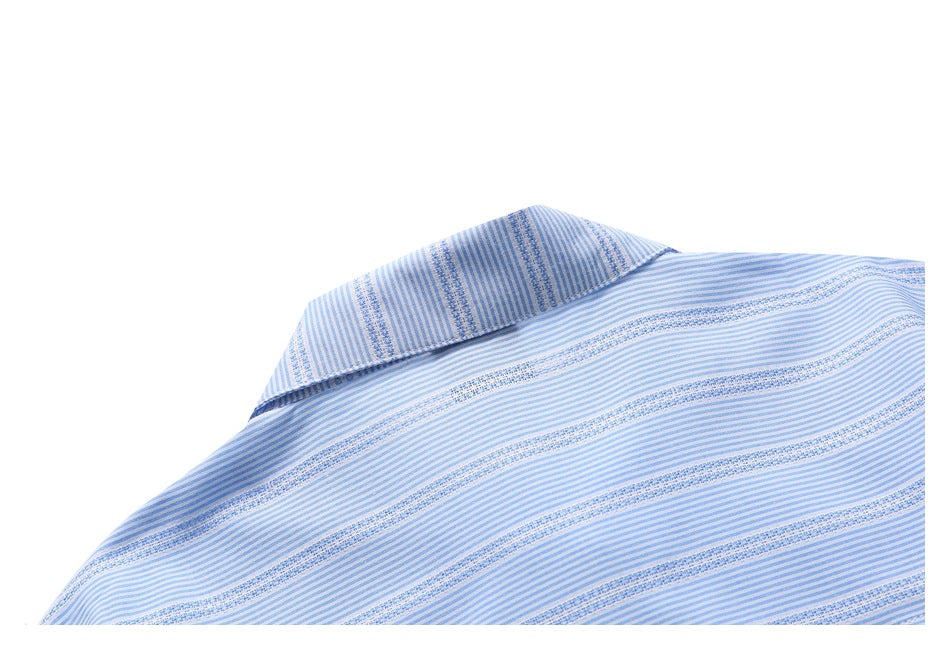 Close-up of the pointed collar and upper yoke of a light blue and white striped shirt.
