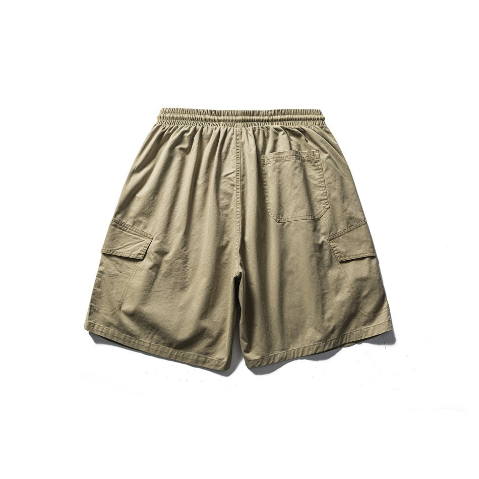Back view of khaki cargo shorts with an elastic waistband, rear pocket, and side flap pockets.