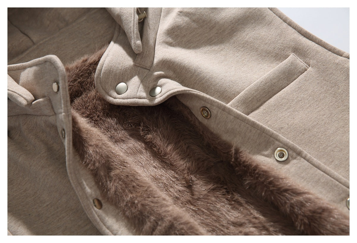 Close-up of the vest's snap-front placket and plush brown lining.