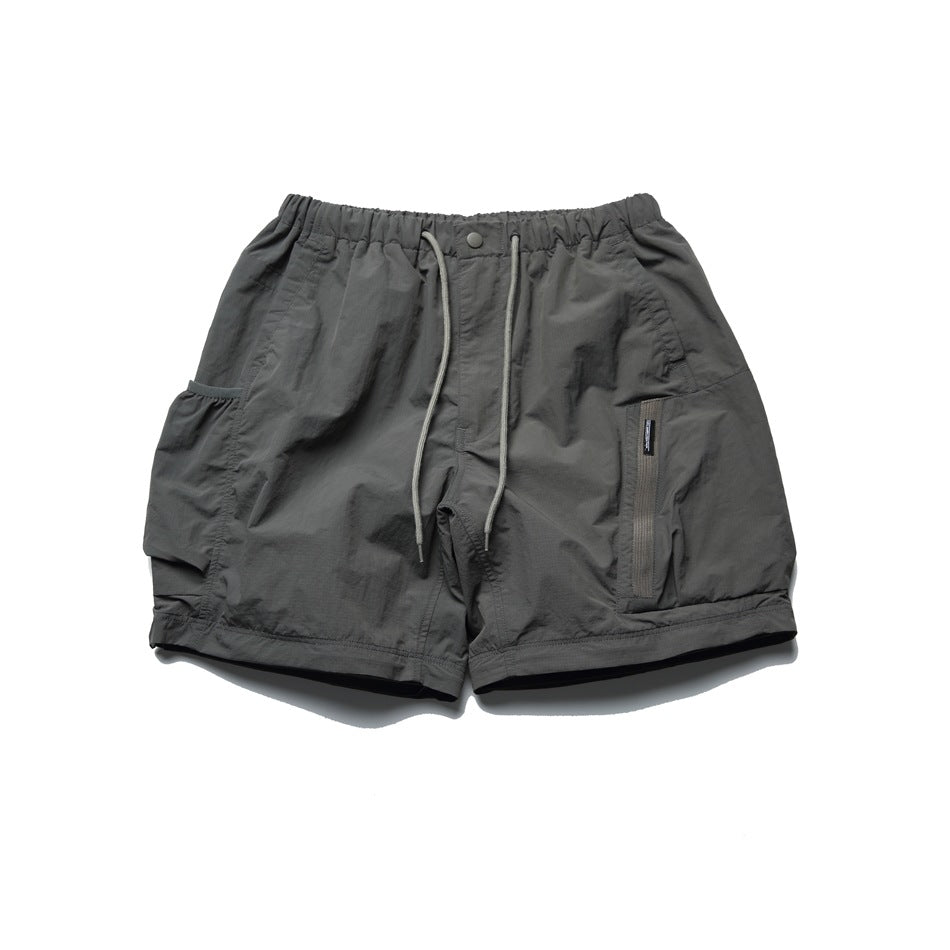 Front flat lay of charcoal shorts with an elastic drawstring waist and multiple pockets.