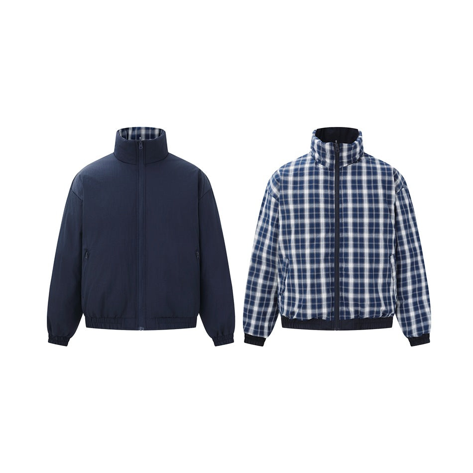 Reversible jacket shown both ways: solid navy side and blue-white plaid side, each with stand collar and zipper