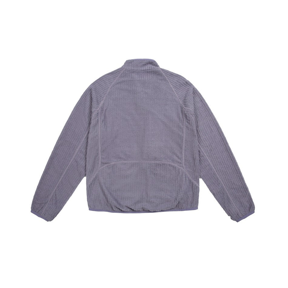 Back view of a muted lavender-gray long-sleeve zip jacket laid flat, showing its stand collar and curved seams.