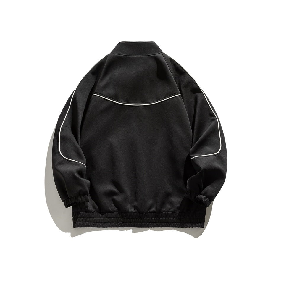 Black zip jacket back view with white piping on the yoke and sleeves and an elasticated hem band