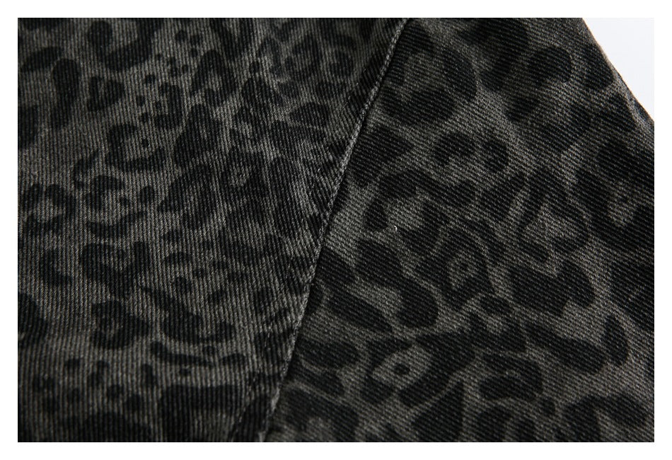 Close-up showing the dark leopard print and diagonal seam on the jacket fabric.
