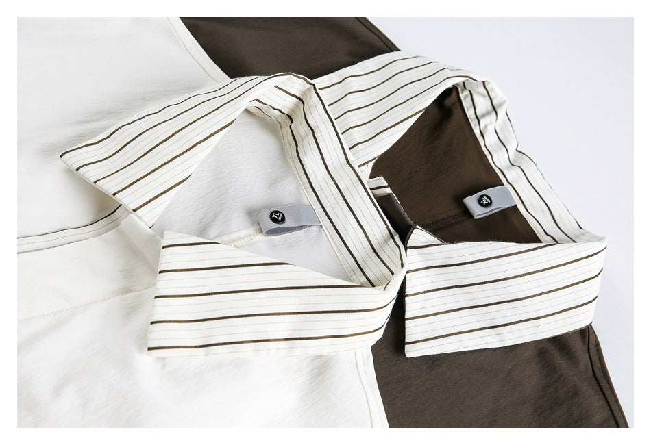 Close-up of striped collars on white and dark brown shirts, showing the inner collar and small garment labels.