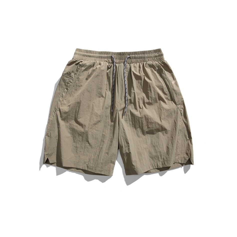 Khaki drawstring shorts with elastic waistband, flat lay front view
