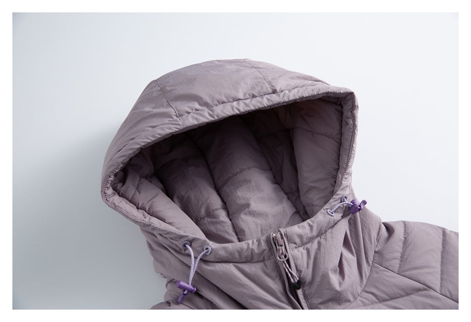 Close-up of a mauve-gray padded jacket hood with quilted lining and purple drawcord toggles.