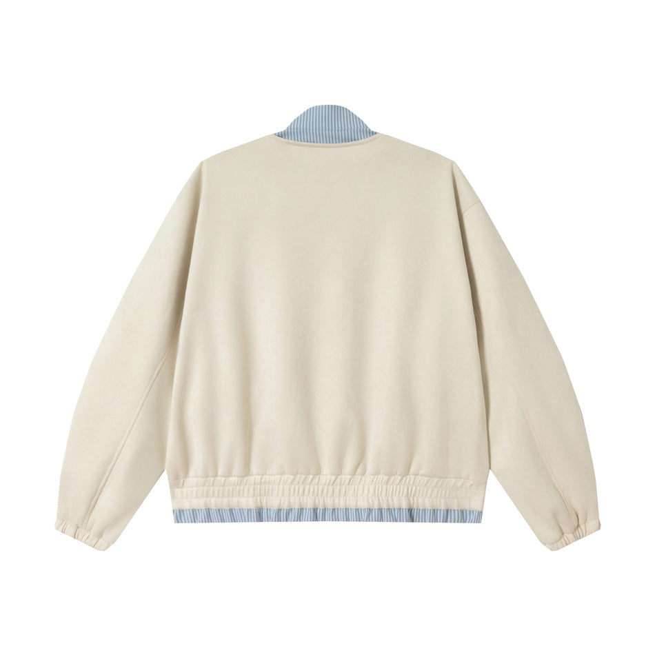Back view of an ivory jacket with elastic cuffs and hem, plus blue-and-white striped trim at the collar and hem.