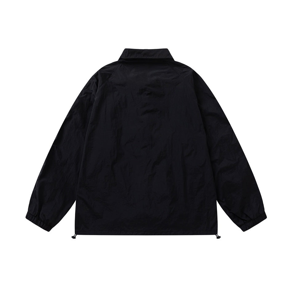 Back view of a black zip jacket with long sleeves, a high collar, and an adjustable hem.