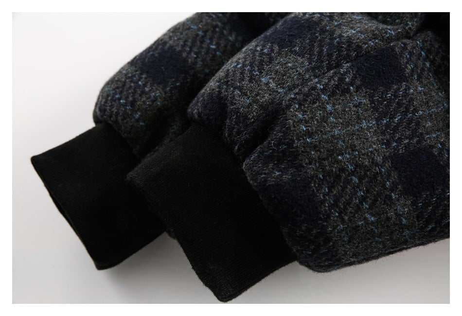 Close-up of dark blue-flecked sleeves ending in wide black ribbed cuffs.