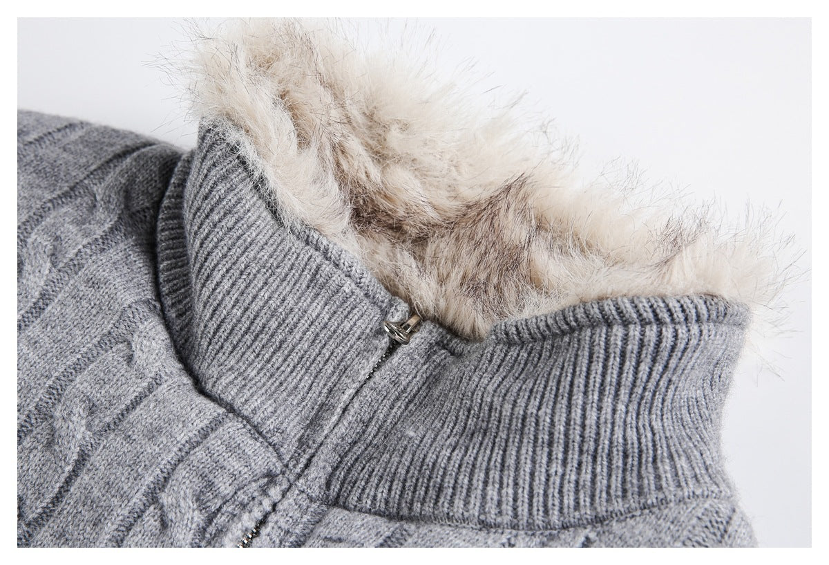Close-up of a gray cable-knit zip sweater with a ribbed collar and plush beige lining.