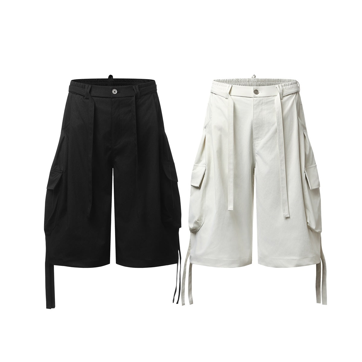Front views of wide-leg cargo shorts in black and ivory, with elastic waistbands, long belt tabs and side pockets.