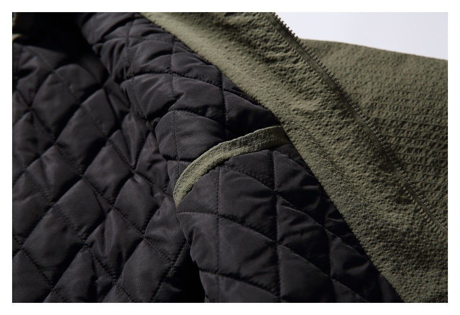 Close-up of the jacket's dark diamond-quilted lining and olive fabric trim.