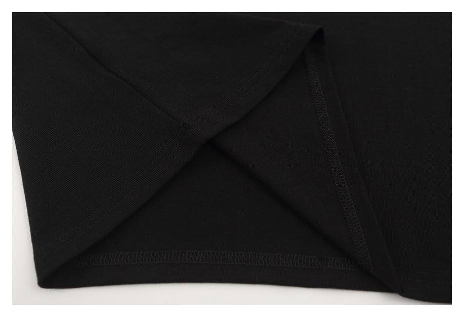 Close-up of the black T-shirt’s inside hem seam and stitching.