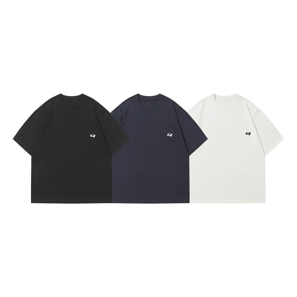 Three short-sleeve crew-neck T-shirts shown front-on in black, navy, and white, each with a small chest emblem.