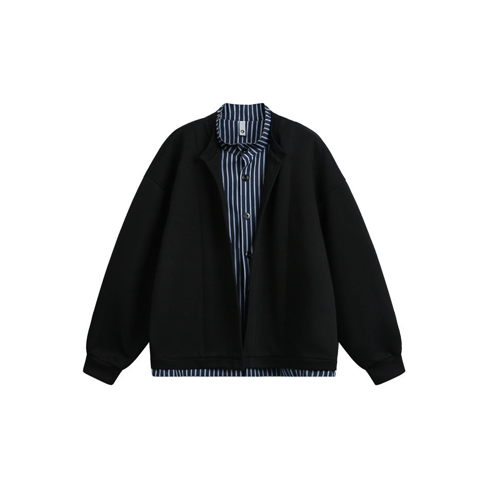 Black open-front jacket with stand collar over a navy and light blue striped button shirt layer