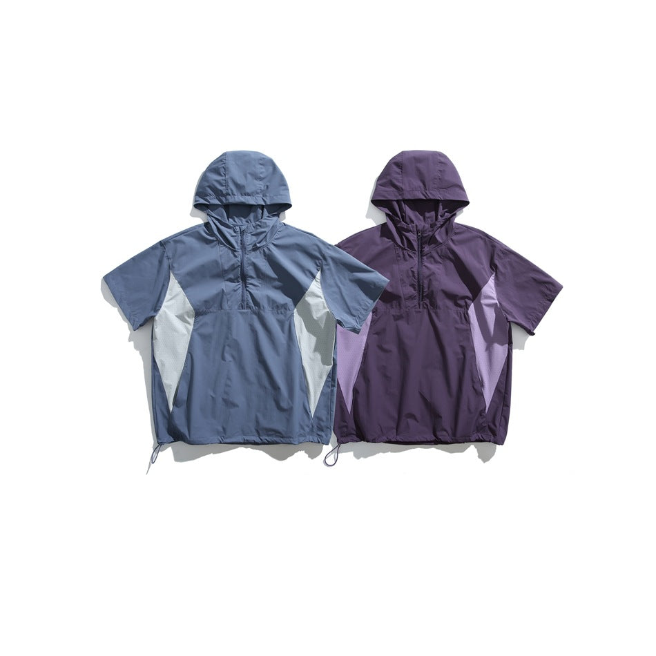 Two short-sleeve hooded pullovers shown flat: slate blue with pale panels and deep purple with lavender panels.