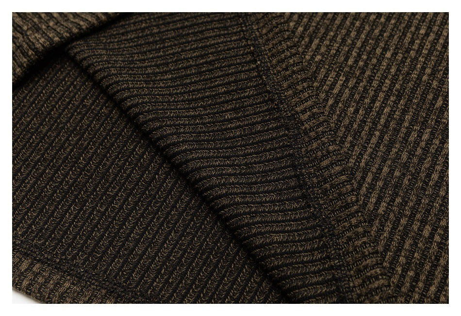Close-up of dark brown and black ribbed knit fabric with a folded section.