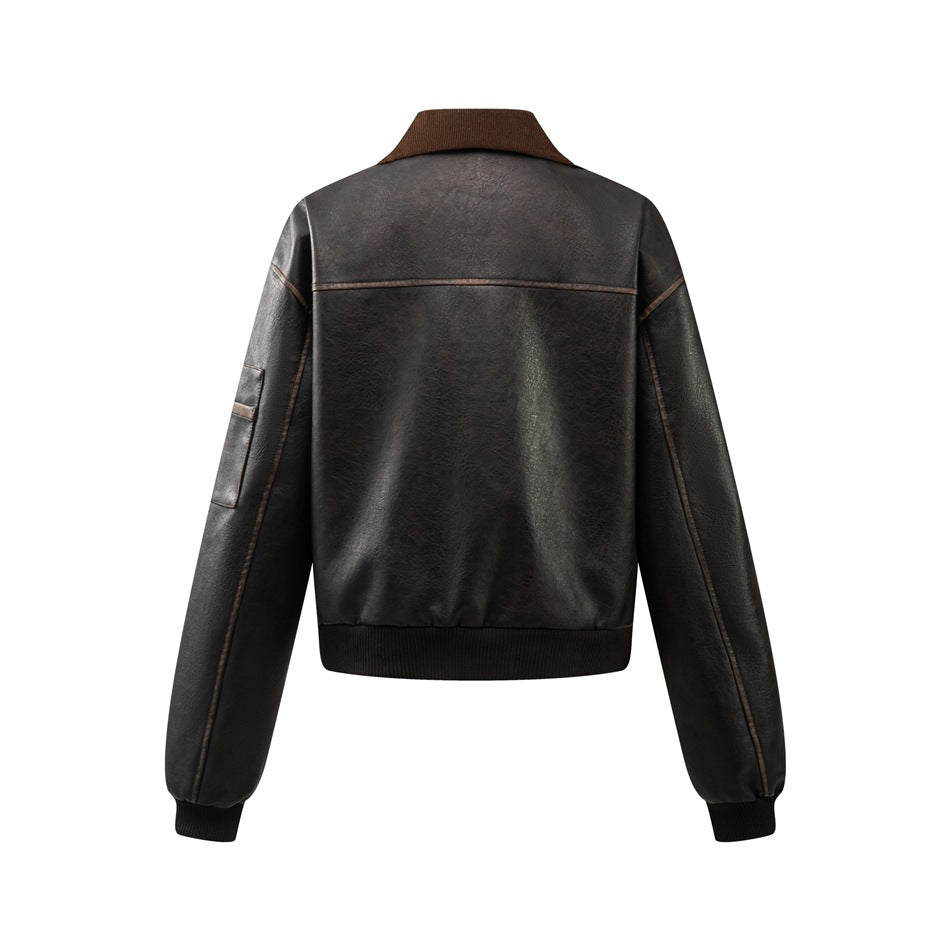 Back view of a dark jacket with a brown collar, seam detailing, and black ribbed hem and cuffs.