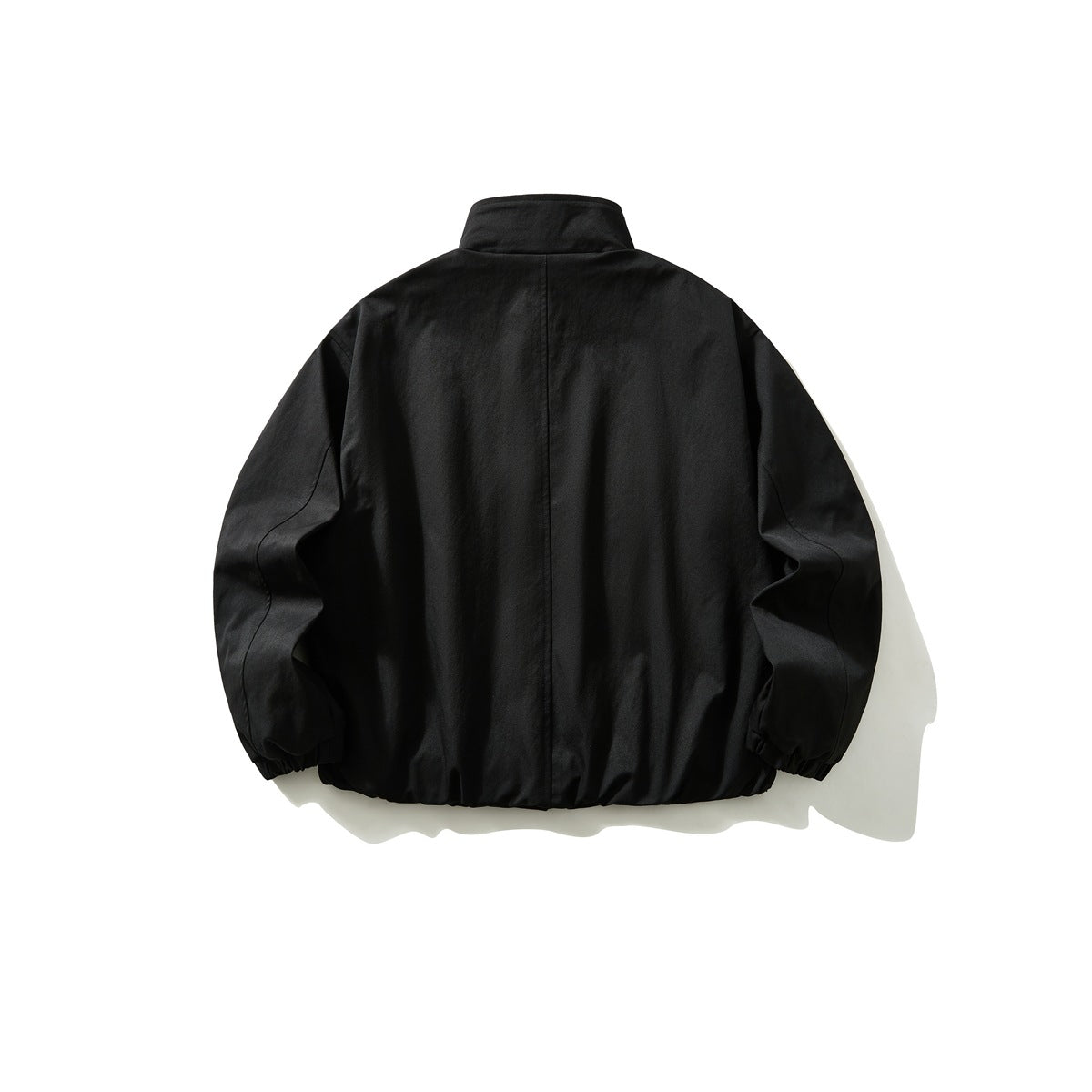 Black stand-collar jacket back view with center back seam, curved sleeve seams and elastic cuffs and hem