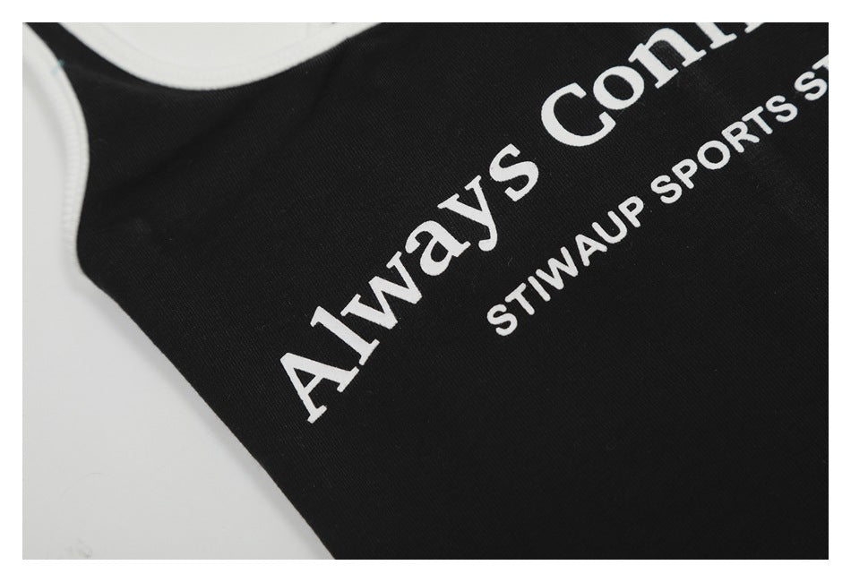 Close-up of white English lettering printed on black fabric.