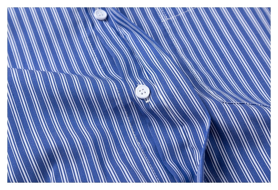 Close-up of the blue and white pinstriped shirt's white buttons and front placket.