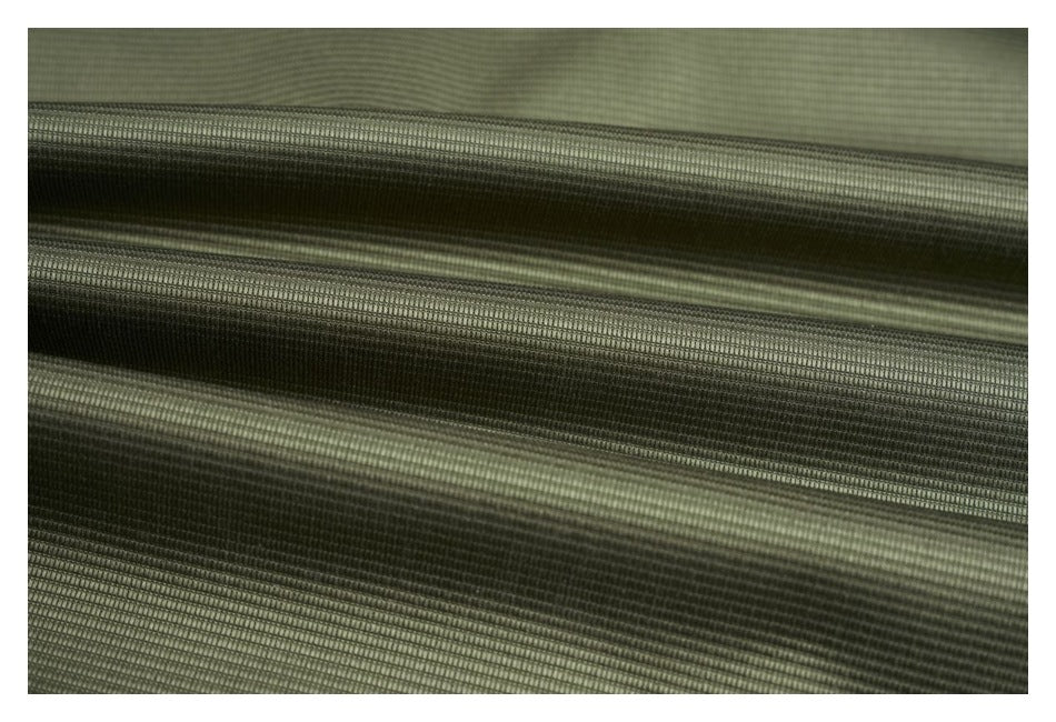Extreme close-up showing the fine ribbed texture and folds of olive fabric.