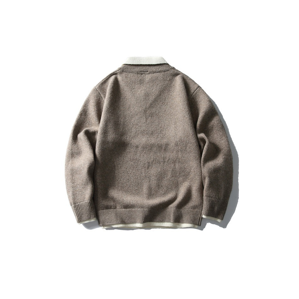 Back view of a taupe knit sweater with a light contrasting collar and ribbed cuffs and hem.