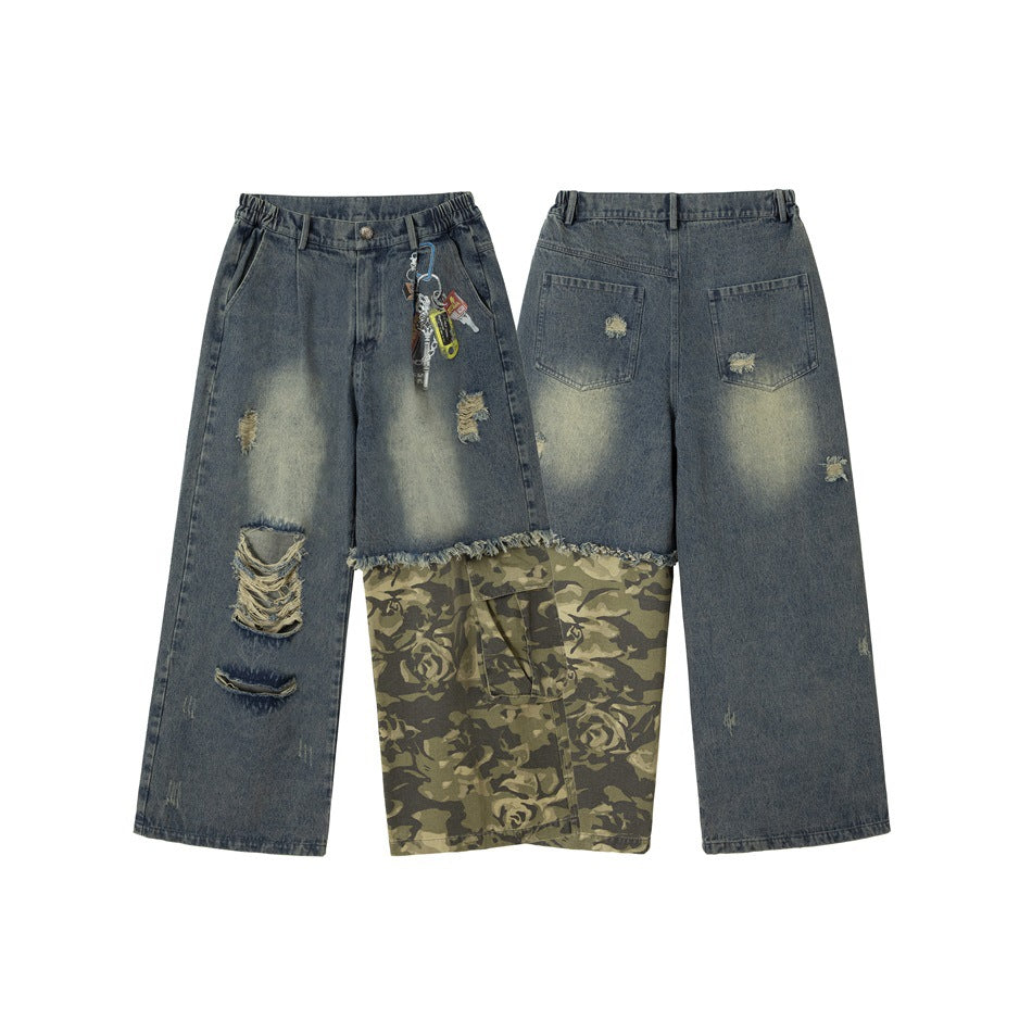 Front and back views of wide-leg faded blue jeans with ripped details, a camouflage-print lower panel, and hanging keychains.