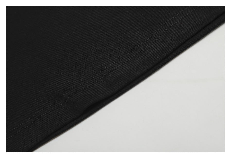 Close-up of the hem and parallel stitching on black fabric.