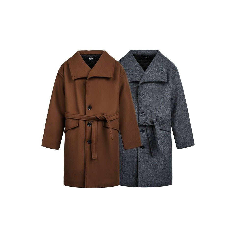 Two belted long coats shown together: one brown and one charcoal gray, both with broad collars and front buttons.