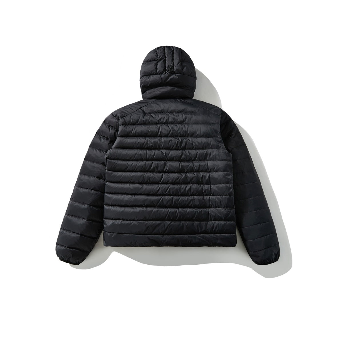 Back view of a black hooded quilted jacket with horizontal stitching.