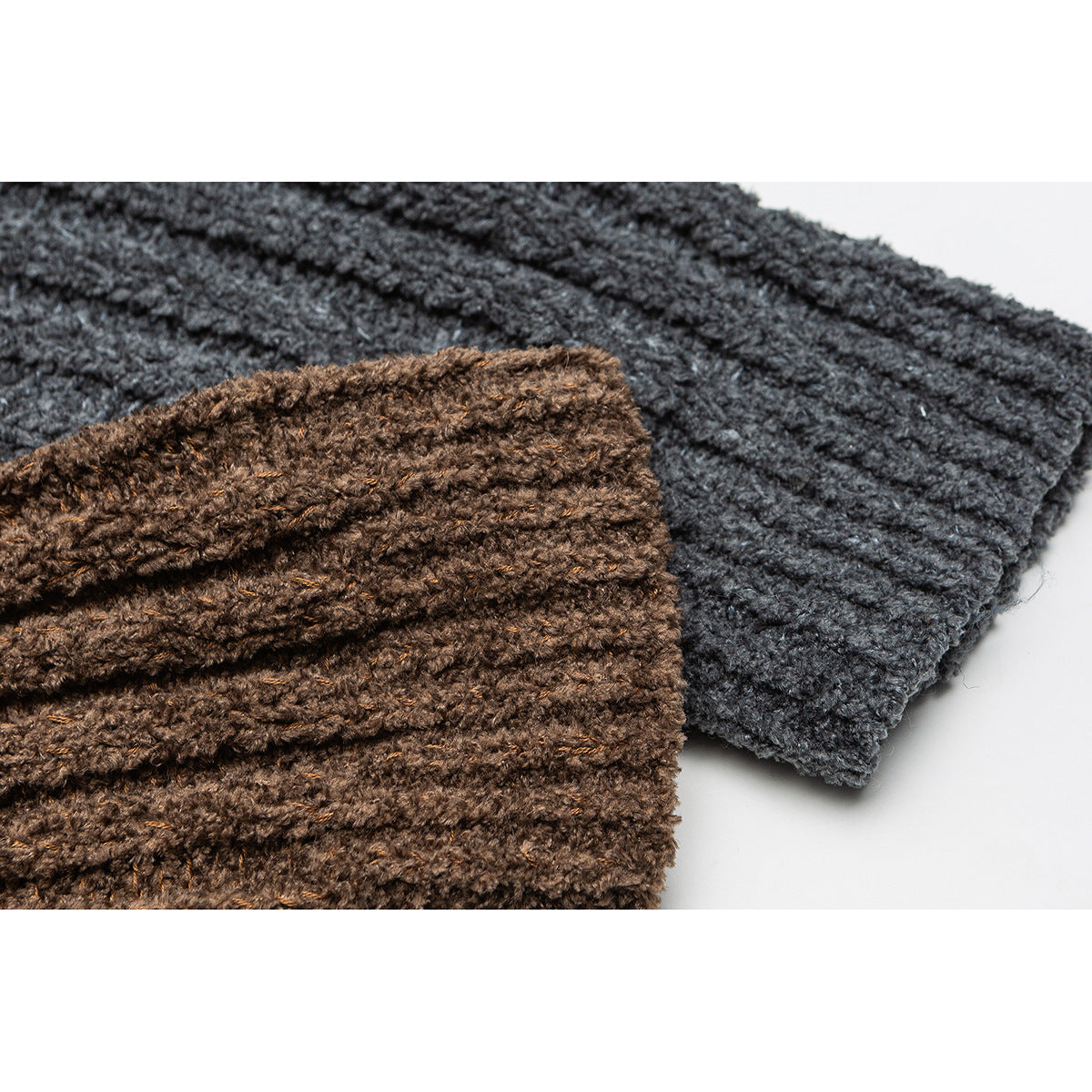 Close-up of brown and charcoal gray chunky rib-knit fabric shown together.