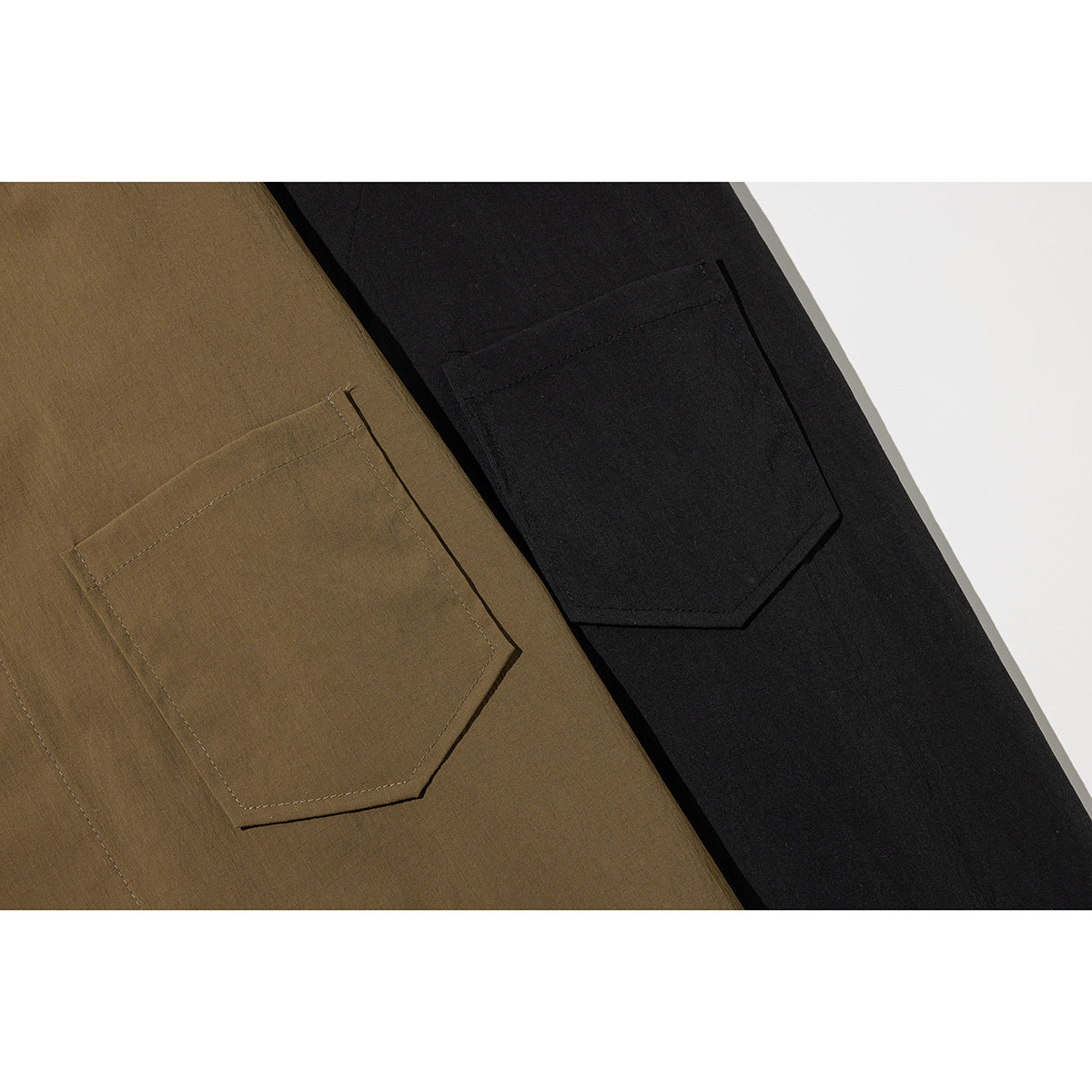 Close-up of angular patch pockets on olive-brown and black shirts.