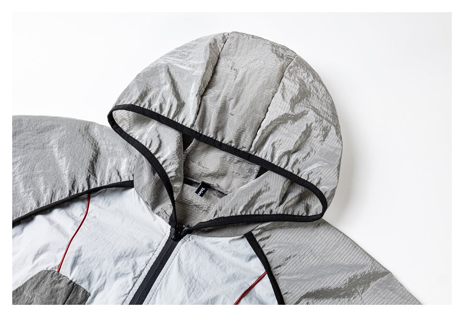 Close-up of the jacket's gray hood, black edging, neckline, and upper zipper.