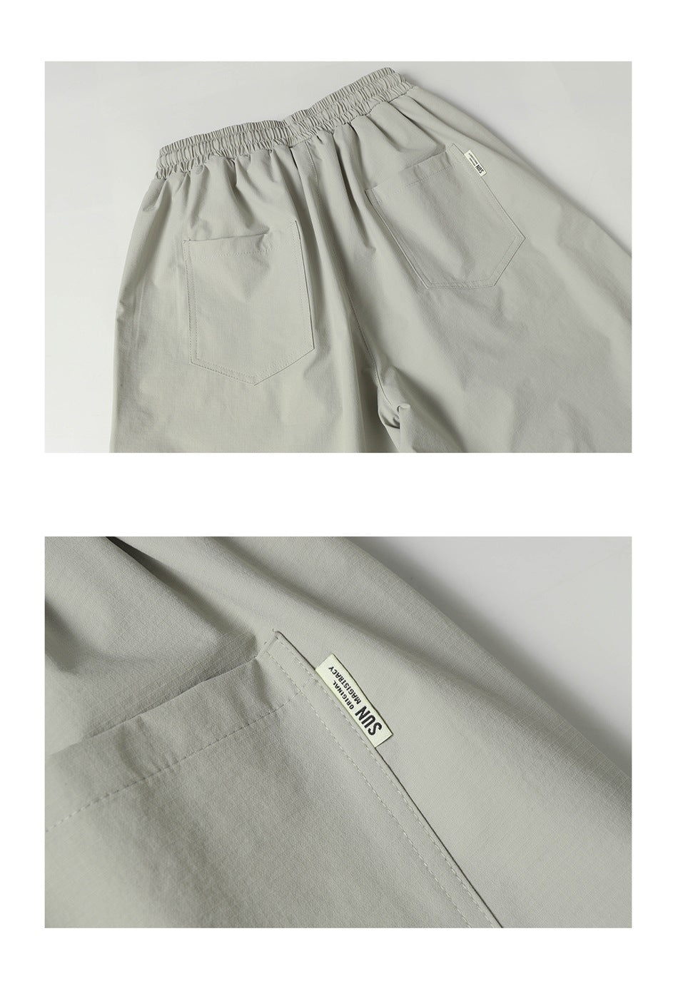 Back view of light gray trousers with a gathered elastic waist and two patch pockets; a small label is on one pocket.