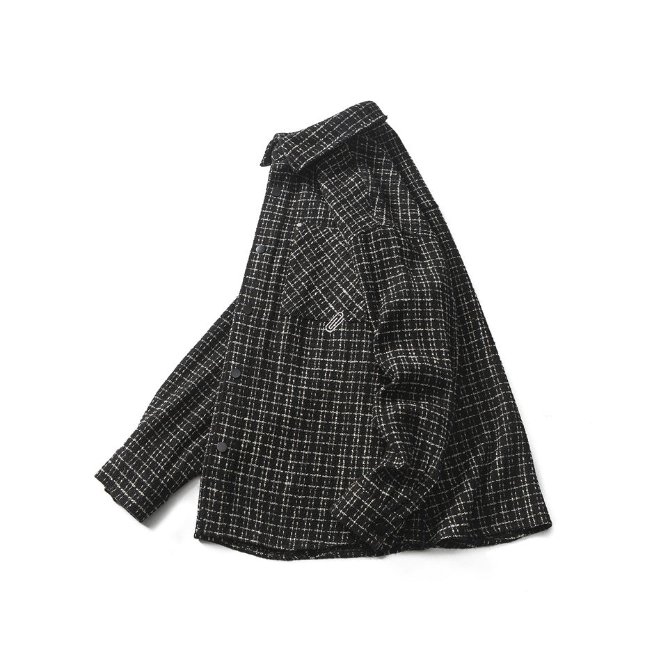 Black-and-white plaid snap-front shirt jacket shown at an angle, with a pointed collar and chest pocket.